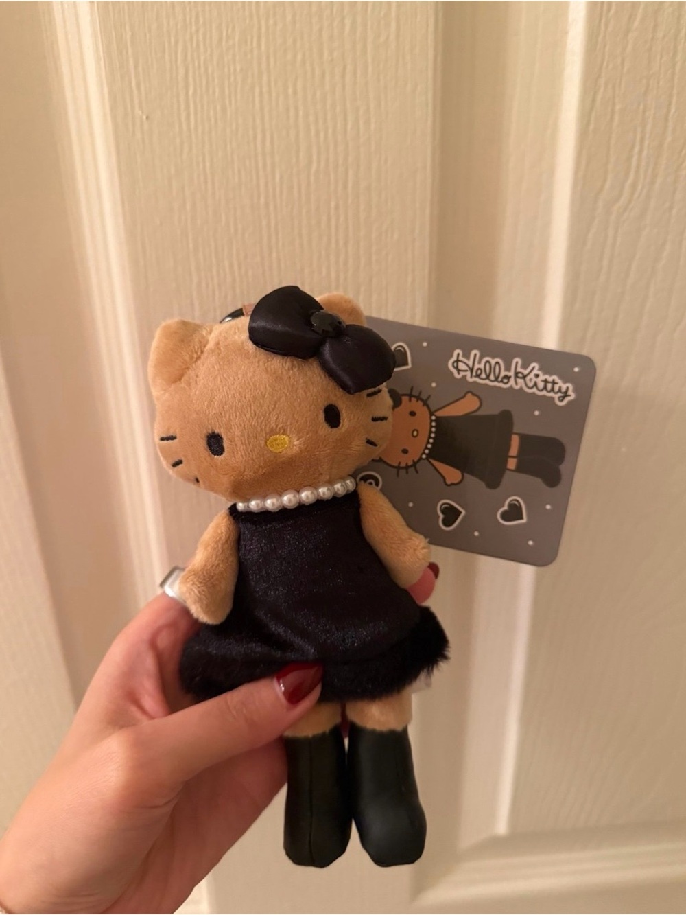Sanrio Hello Kitty Tan Plush Keychain with Black Outfit and Bow